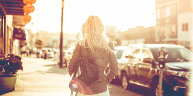 Young Girl Walking Down the Street